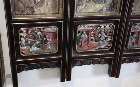 A Chinese 12 panel polychrome and gilt wood screen, 19th century, 274cm x 118cm, hinges removed for hanging